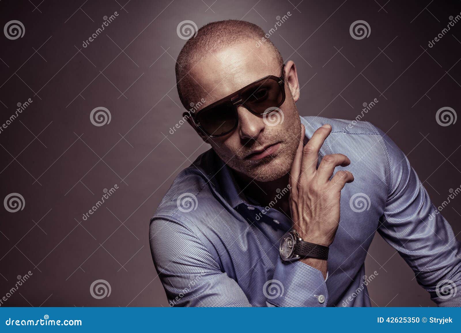 suave handsome man in sunglasses