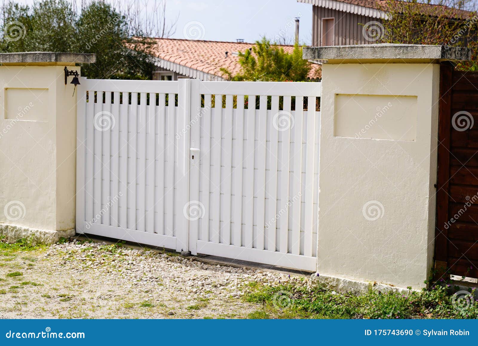 Suburban Metal Gate White Fence on Home Suburb Street Access House