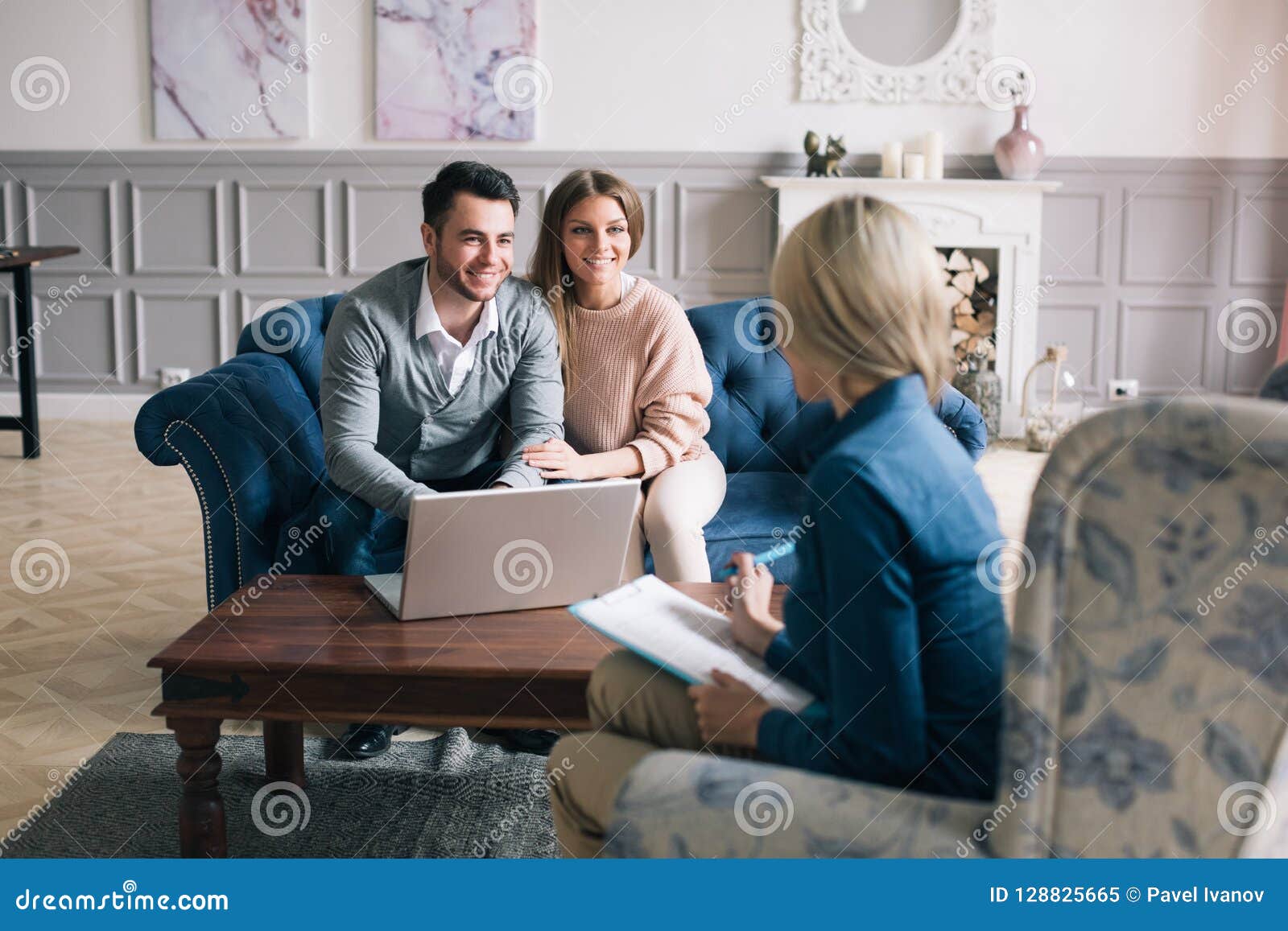 successful agent giving consultation to family couple about buying house.