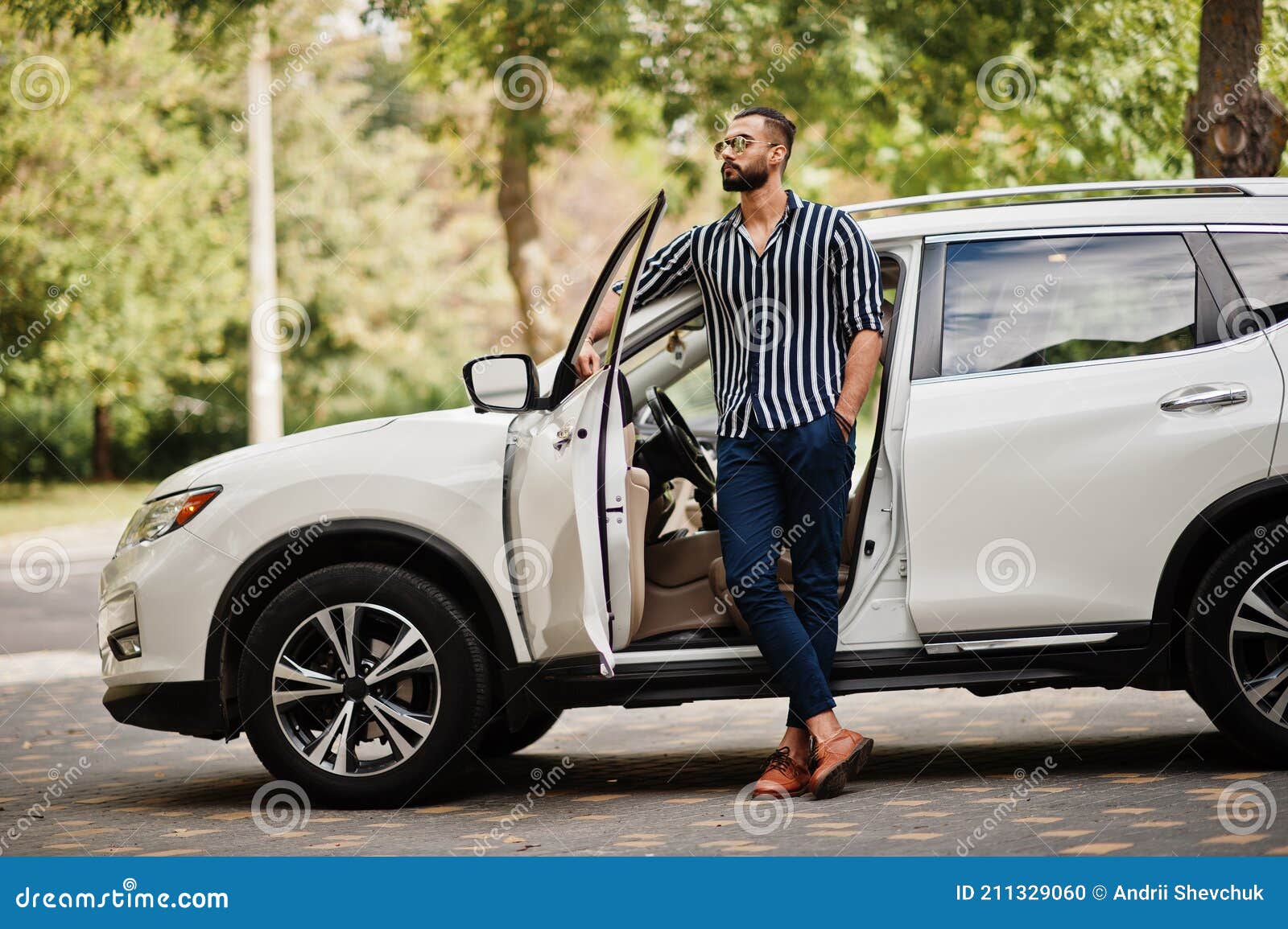 Attractive man posing in convertible car Stock Photo - Alamy