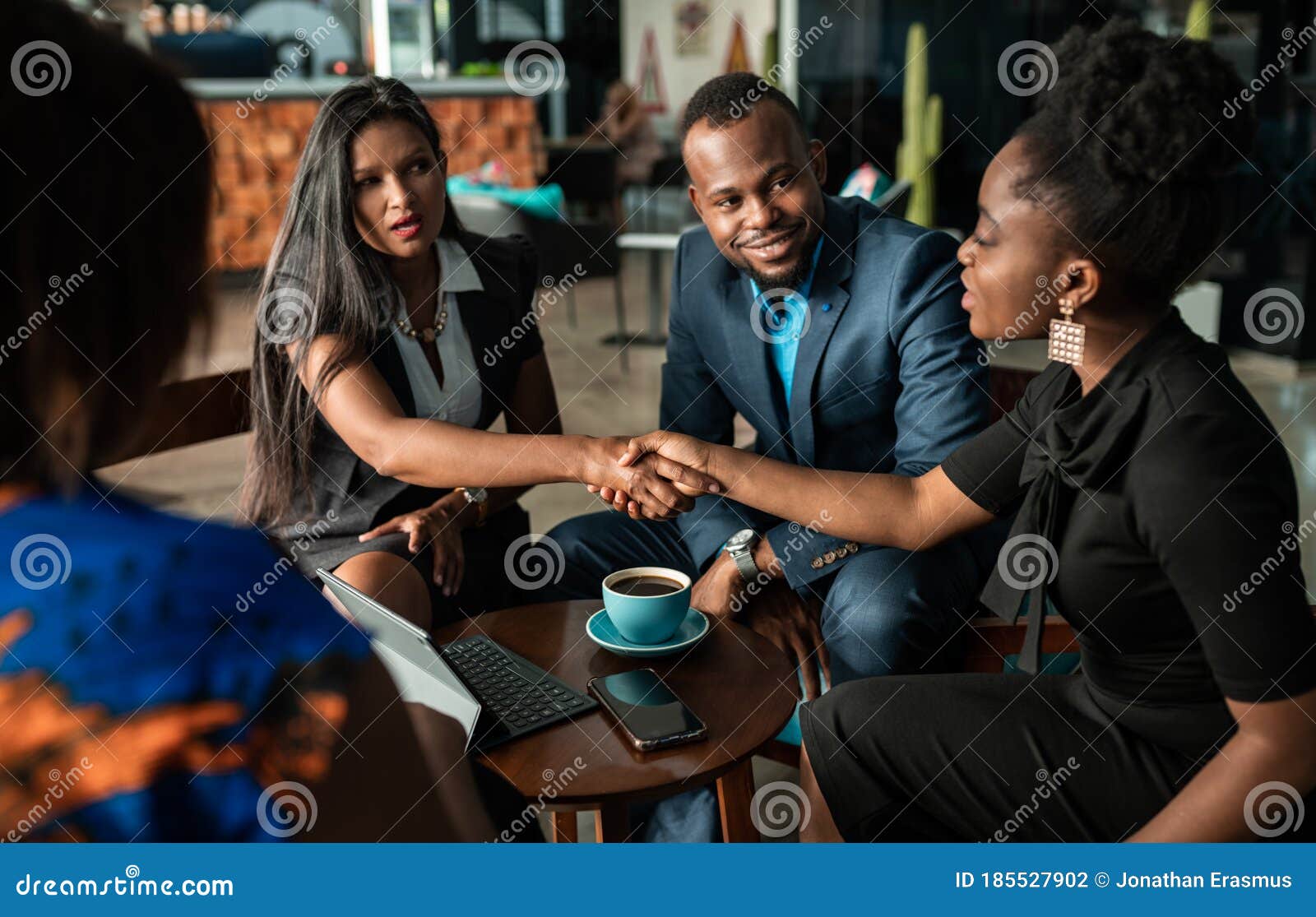 successful black south african businesswoman interview applicant shaking hands with human resources manager