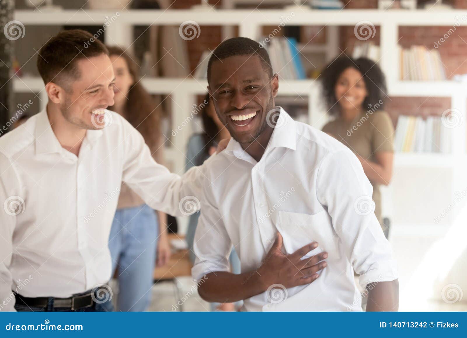 successful black businessman looking at camera celebrating success got promotion