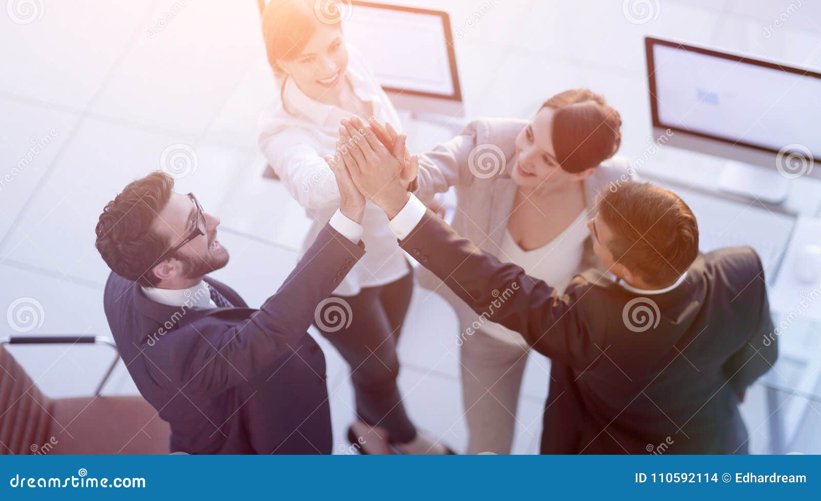 Successful Business Team Giving Each Other A High Five Standing Stock