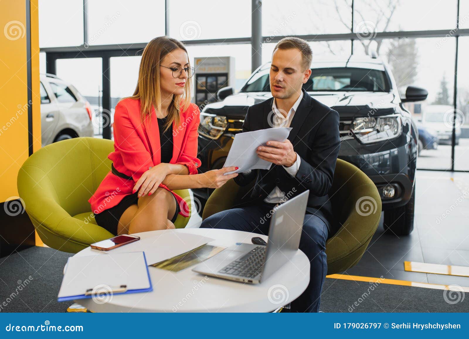 Successful Businessman in a Car Dealership Sale of Vehicles To