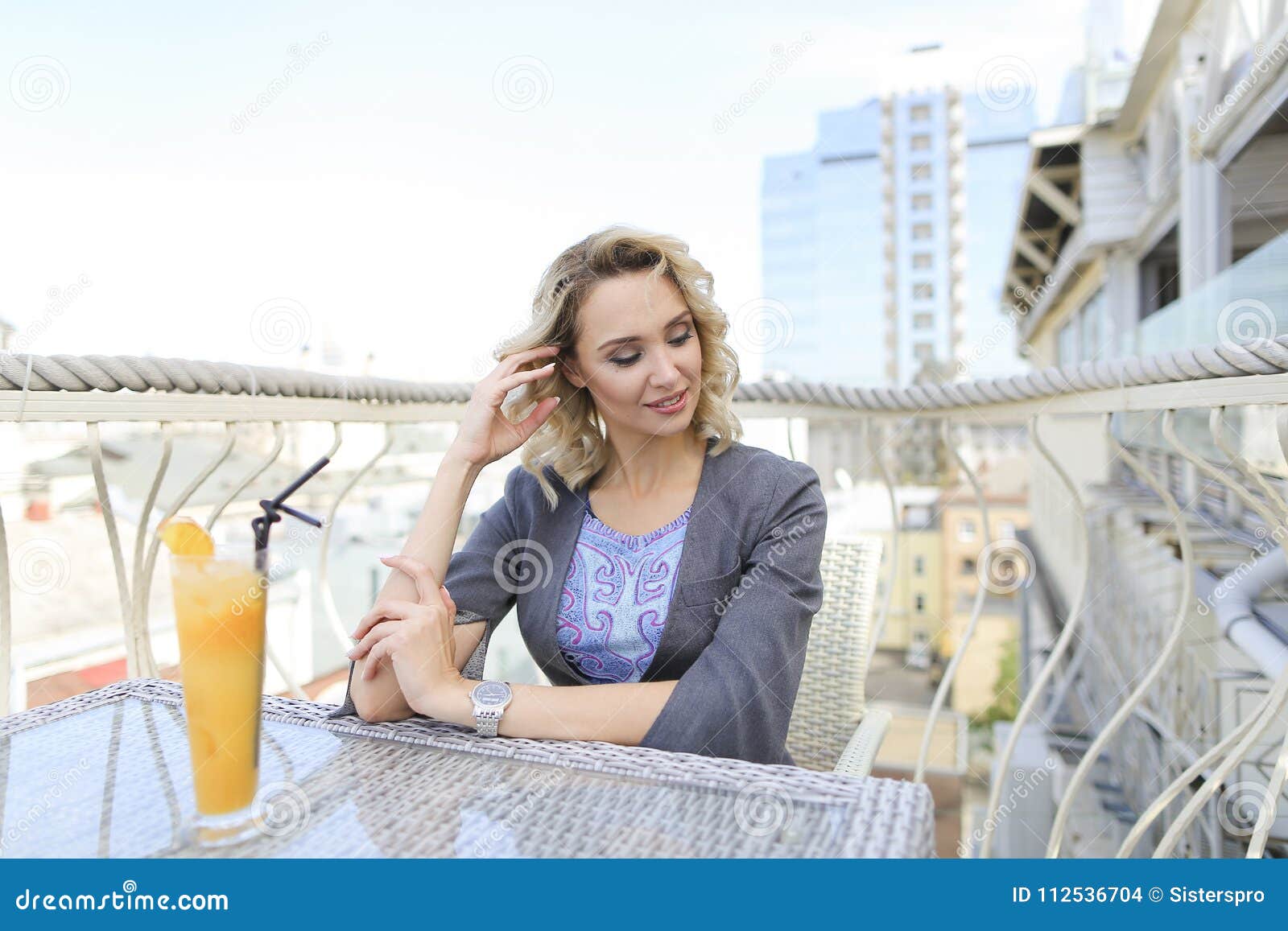 Successful Female Person Drinking Juice at Cafe on Balcony with ...