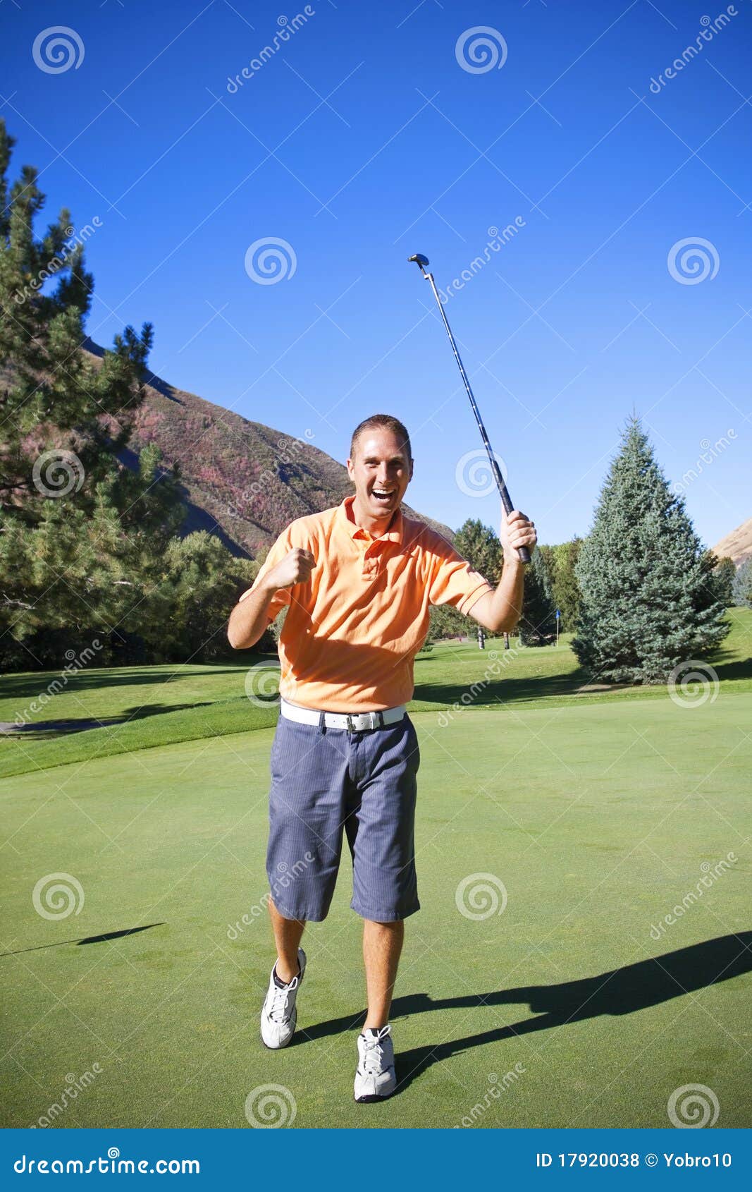 successful golfer making putt
