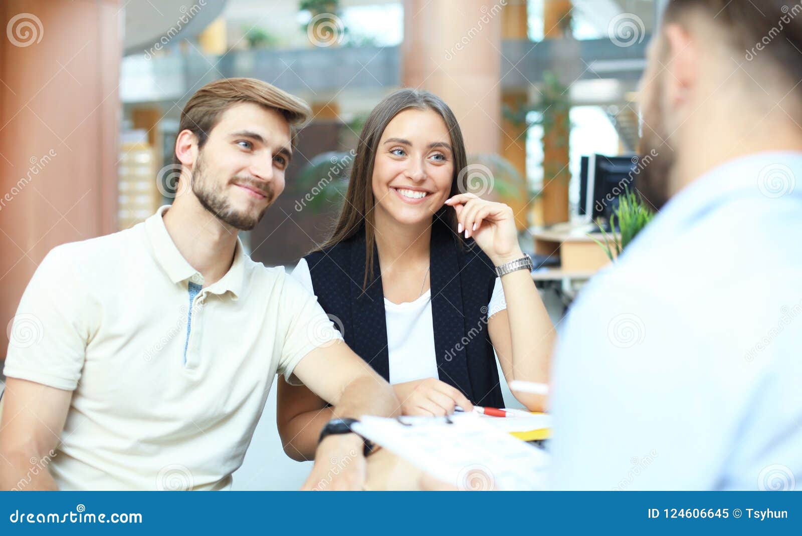 Successful Lawyer Giving Consultation To Family Couple about Buying Successful Lawyer Giving Consultation To Family Couple about Buying