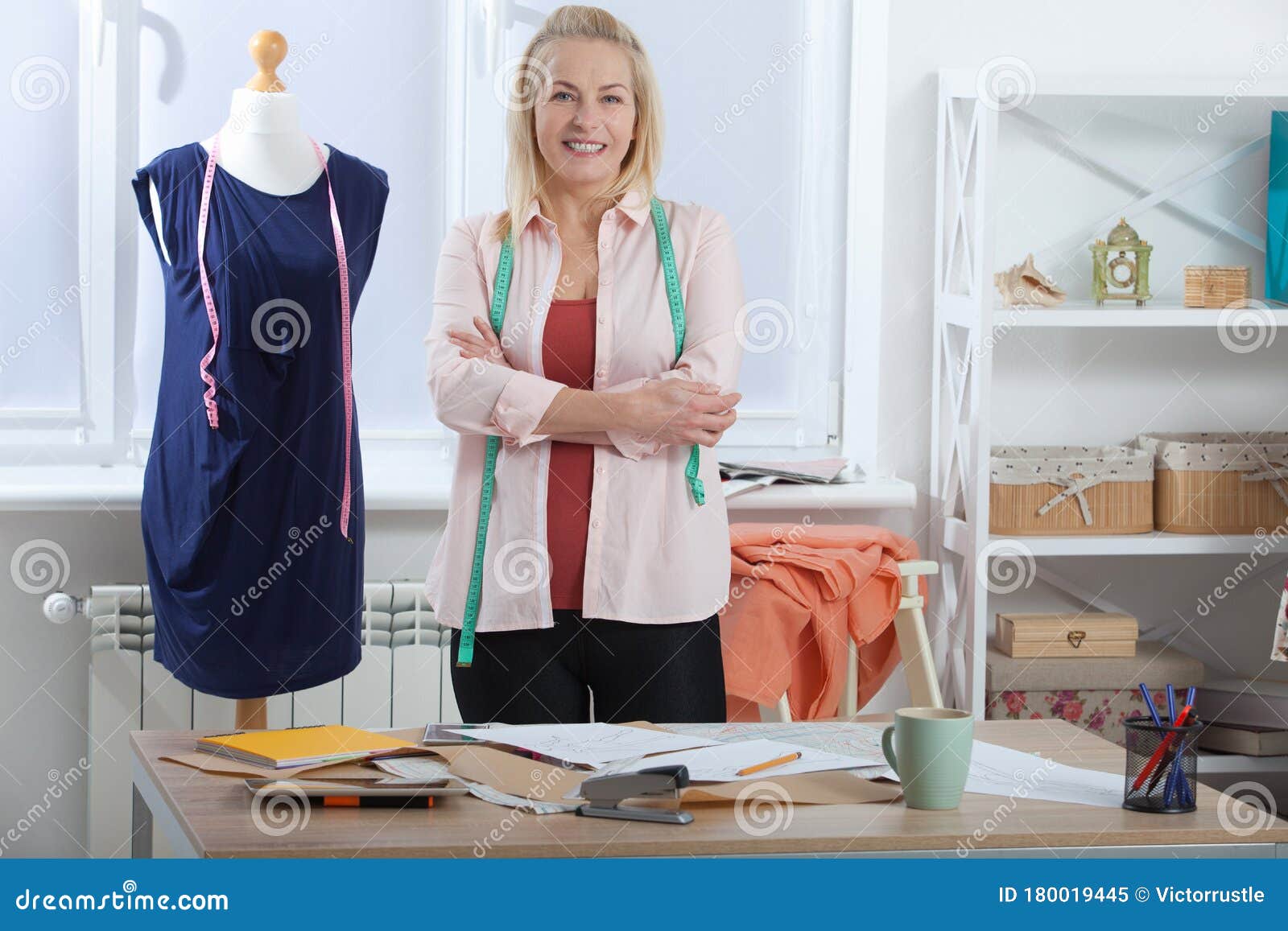 A Successful Woman Designer Clothes, Tailor in the Studio in Full ...