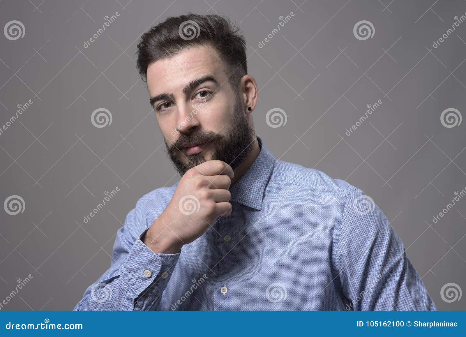 Successful Young Adult Business Man Touching Beard Looking at Camera ...