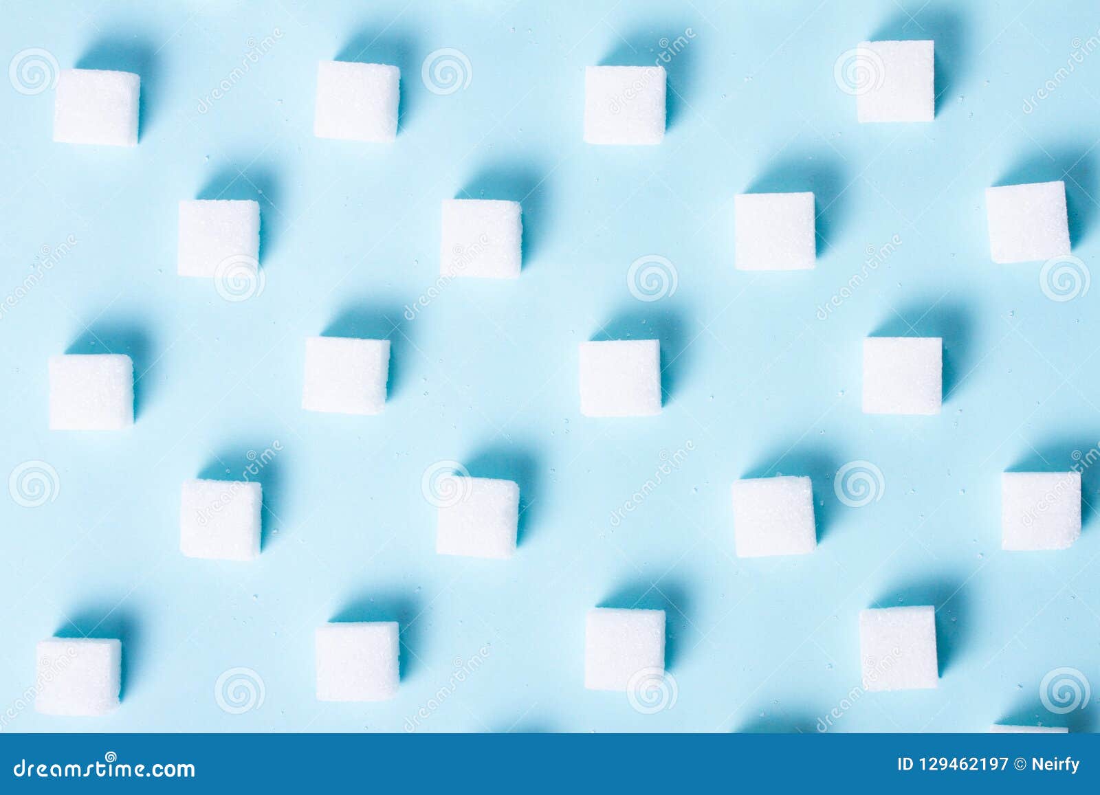 Sugar on blue background stock image. Image of cube - 129462197