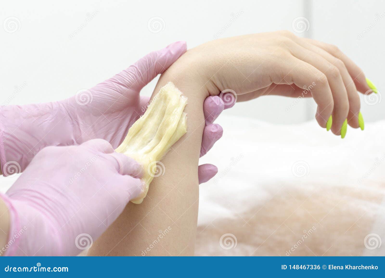 sugar depilation cosmetic procedure applying shugaring paste on skin arm