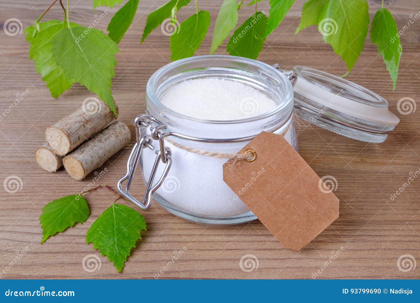 sugar substitute xylitol, a glass jar with birch sugar and a label for text in your language