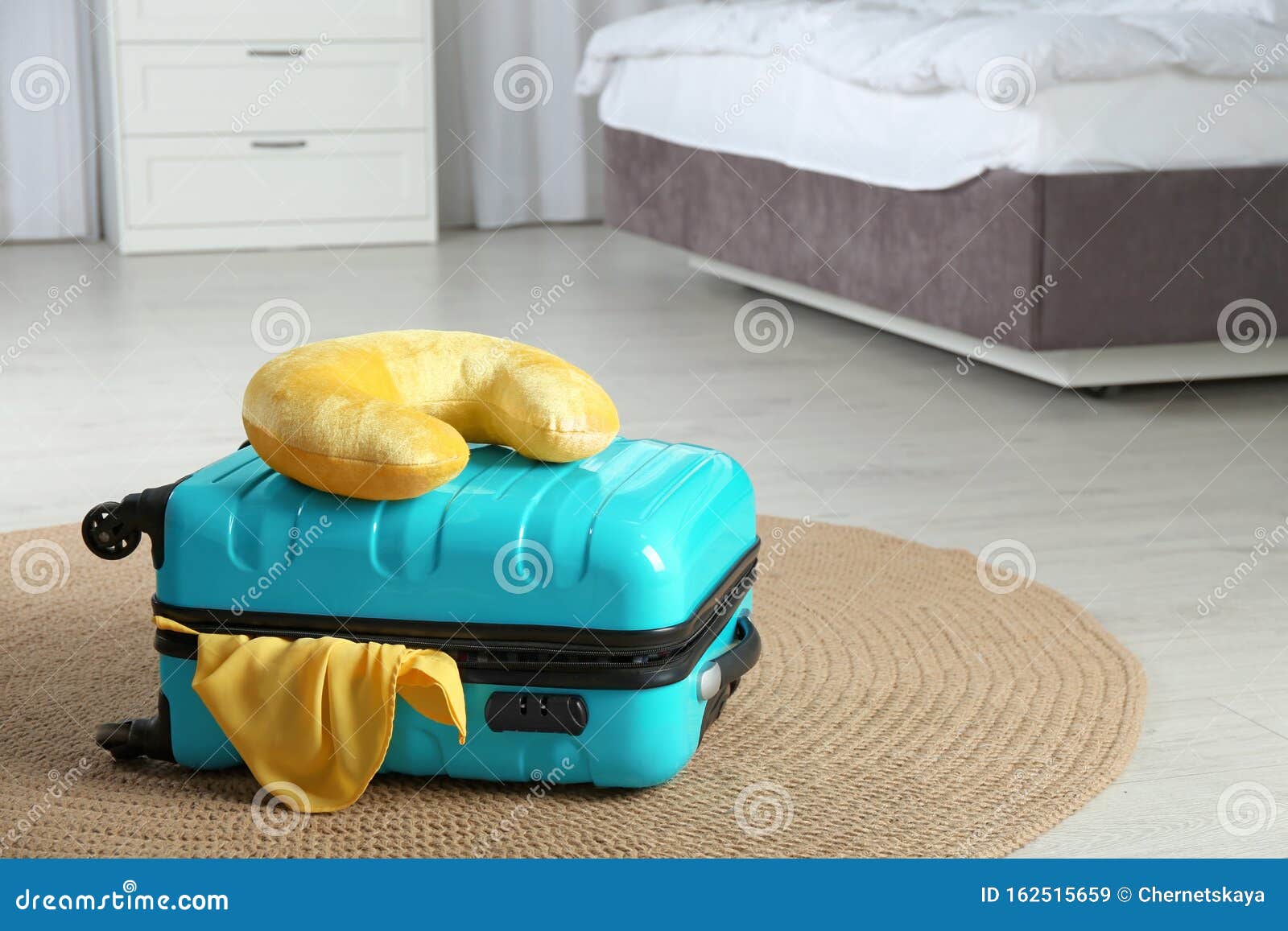 Suitcase with Clothes and Travel Pillow Stock Image Image of