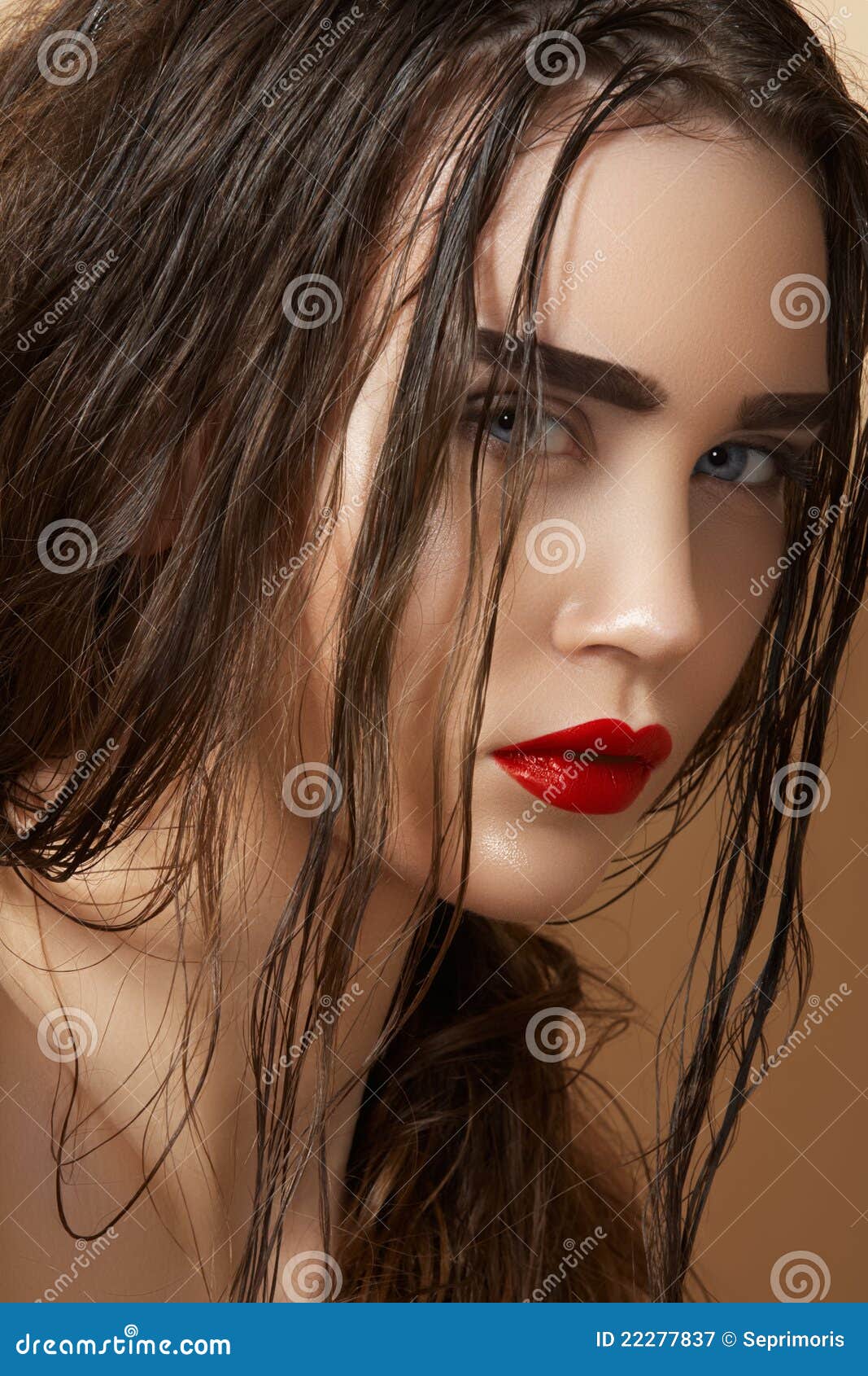 sultry look of model with damp wet hair & make-up