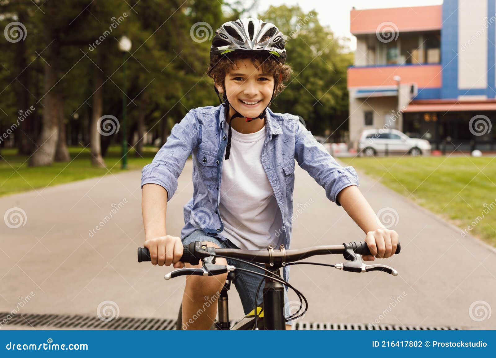 Smiling Boy Learning To Ride a Bicycle in Park Stock Photo - Image of ...
