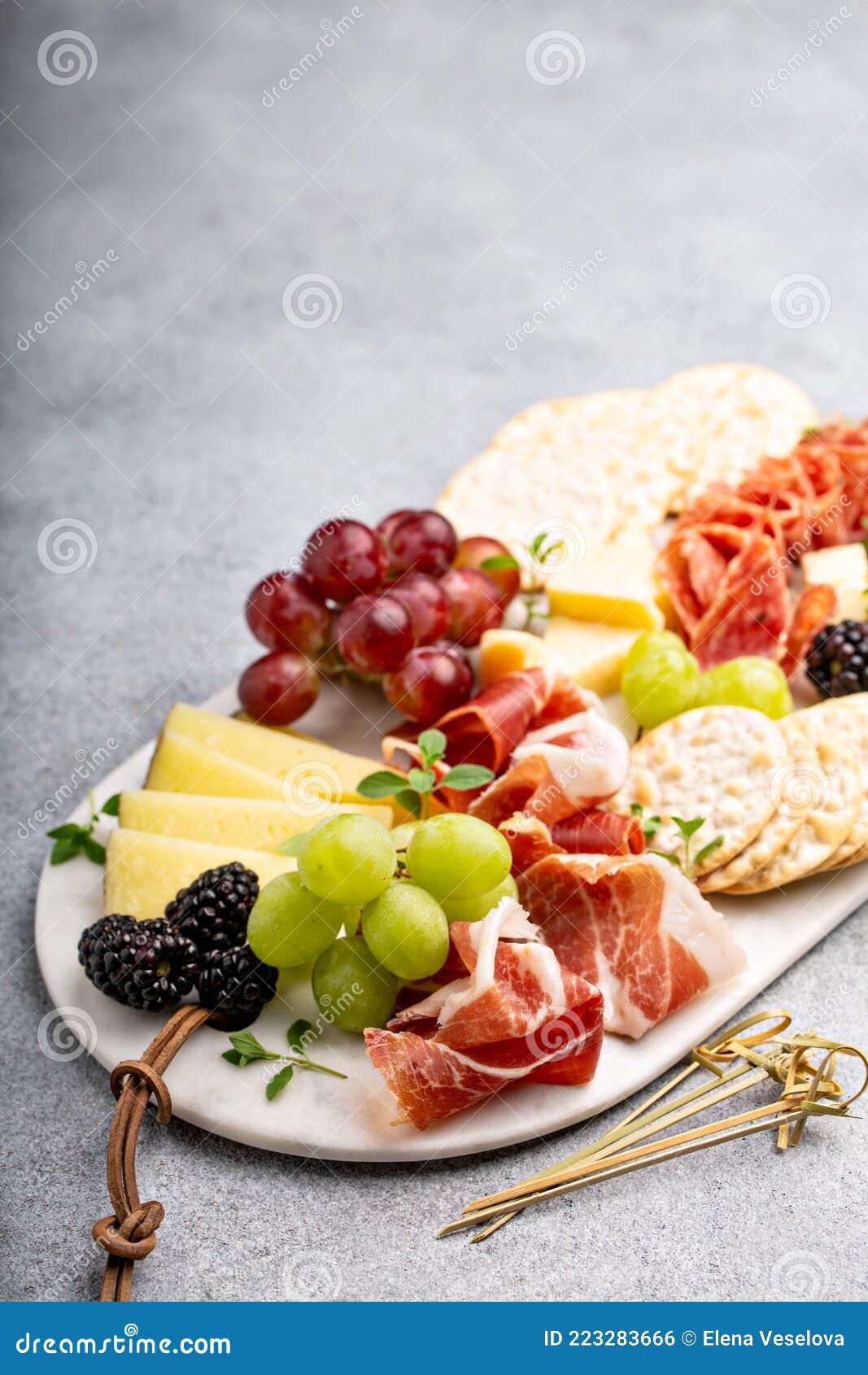Summer Charcuterie Board with Cheese, Meat and Fruit Stock Photo