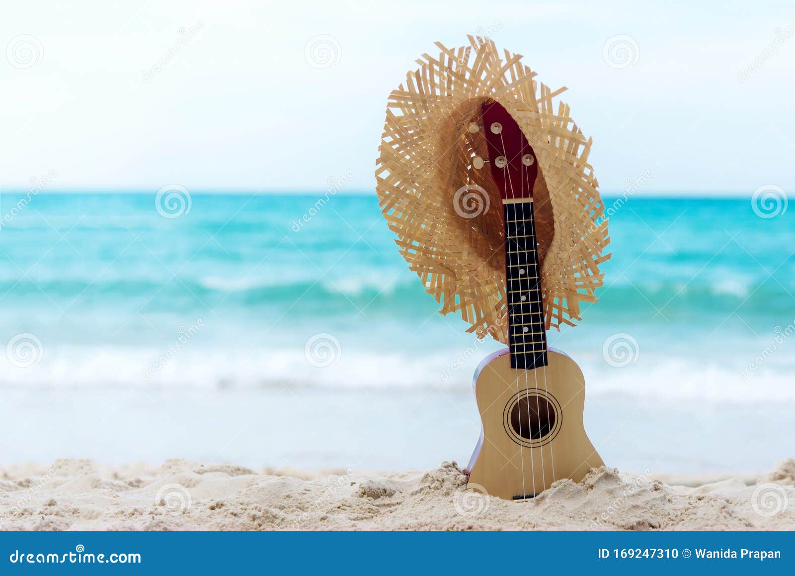 the summer day with guitar ukulele items travel for relax and chills on the beautiful beach and blue sky background,copy space.