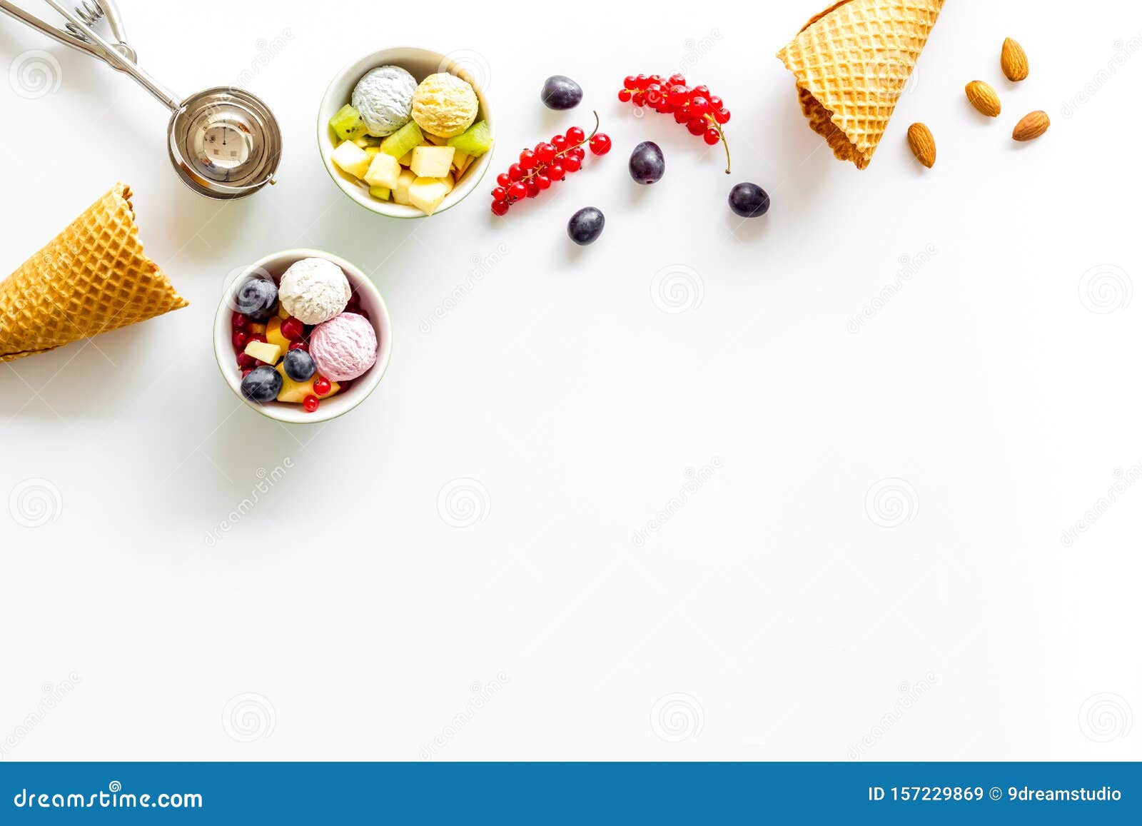 summer dessert with ice cream, hazelnut and wineberry on white backgroung top view mock up