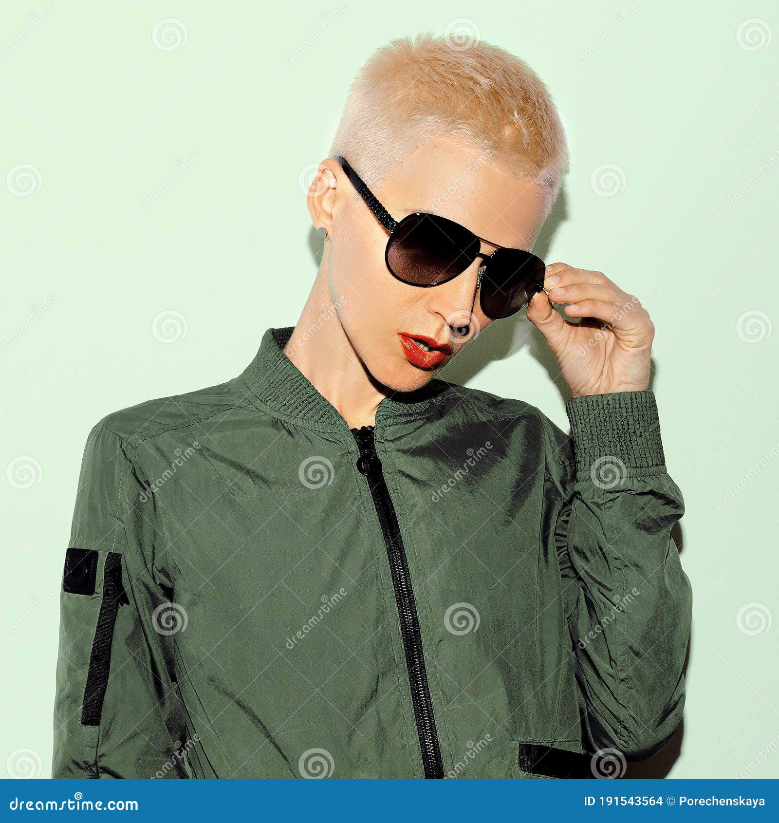 Blonde Model in Military Style and Fashion Sunglasses Stock Photo ...