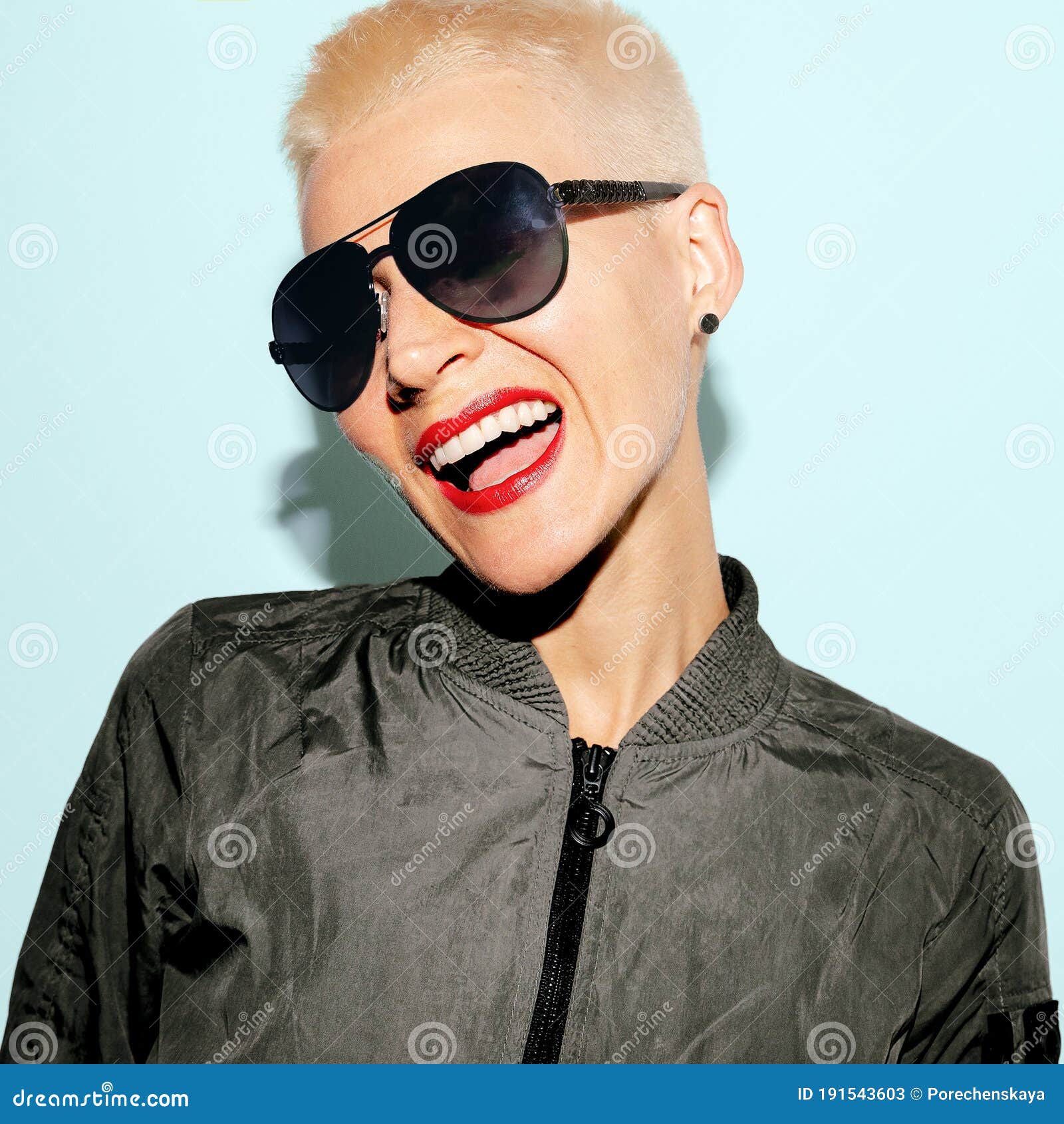 Smile Blonde Girl with Trend Short Hair in Military Style and Fashion ...