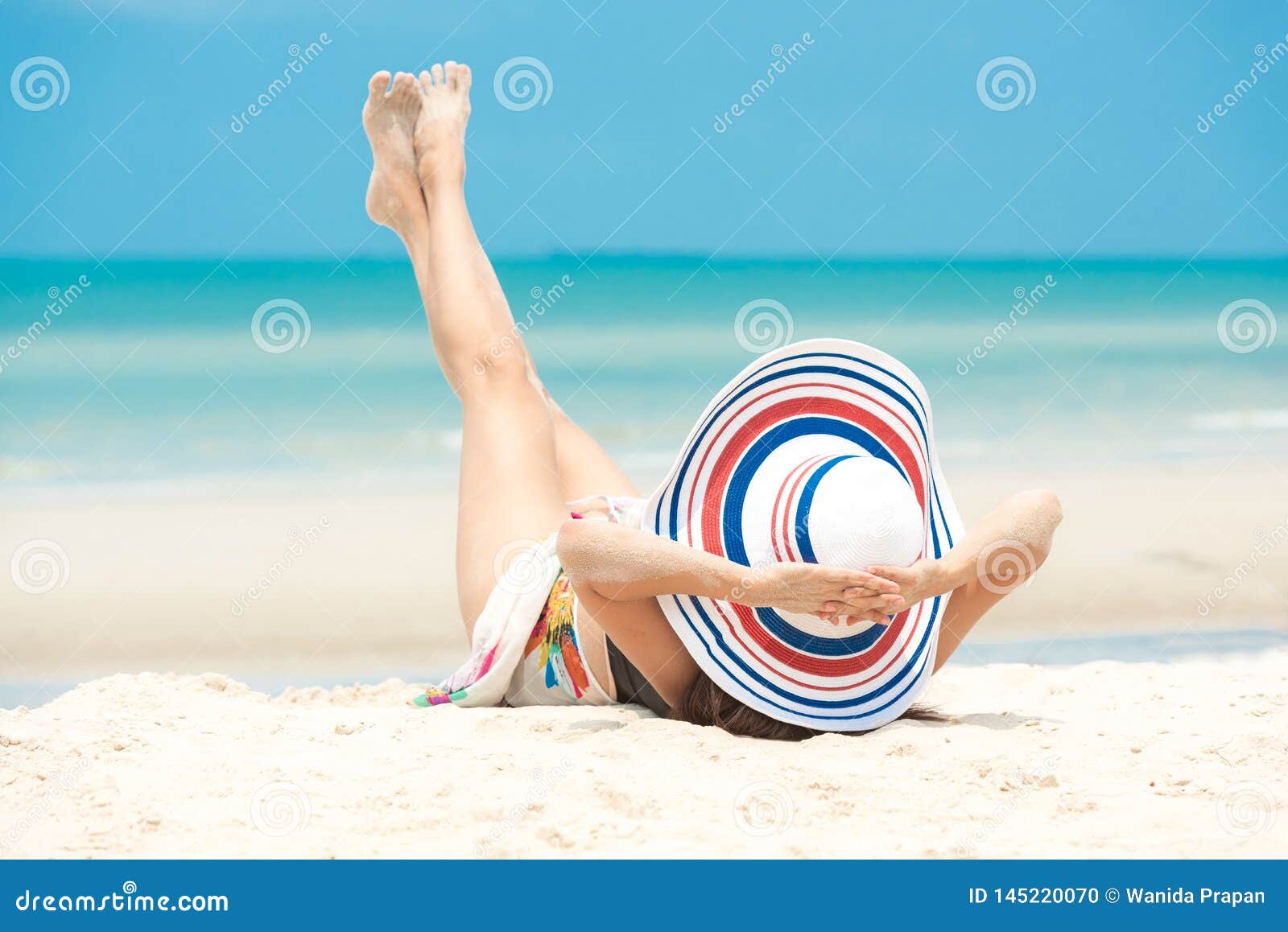 summer holiday.  lifestyle smiling asian woman wearing bikini fashion summer trips relax on the sandy ocean beach. happy woman enj