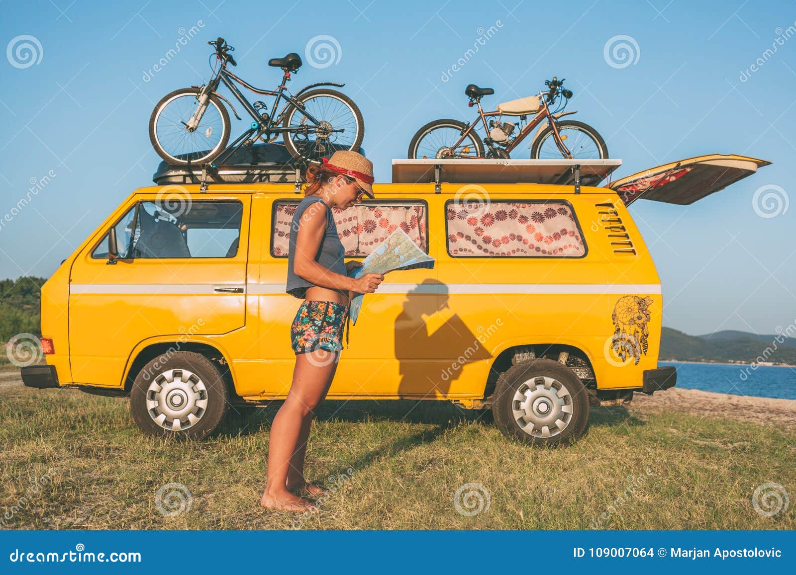 Young Hippie Women In Front Of Minivan 