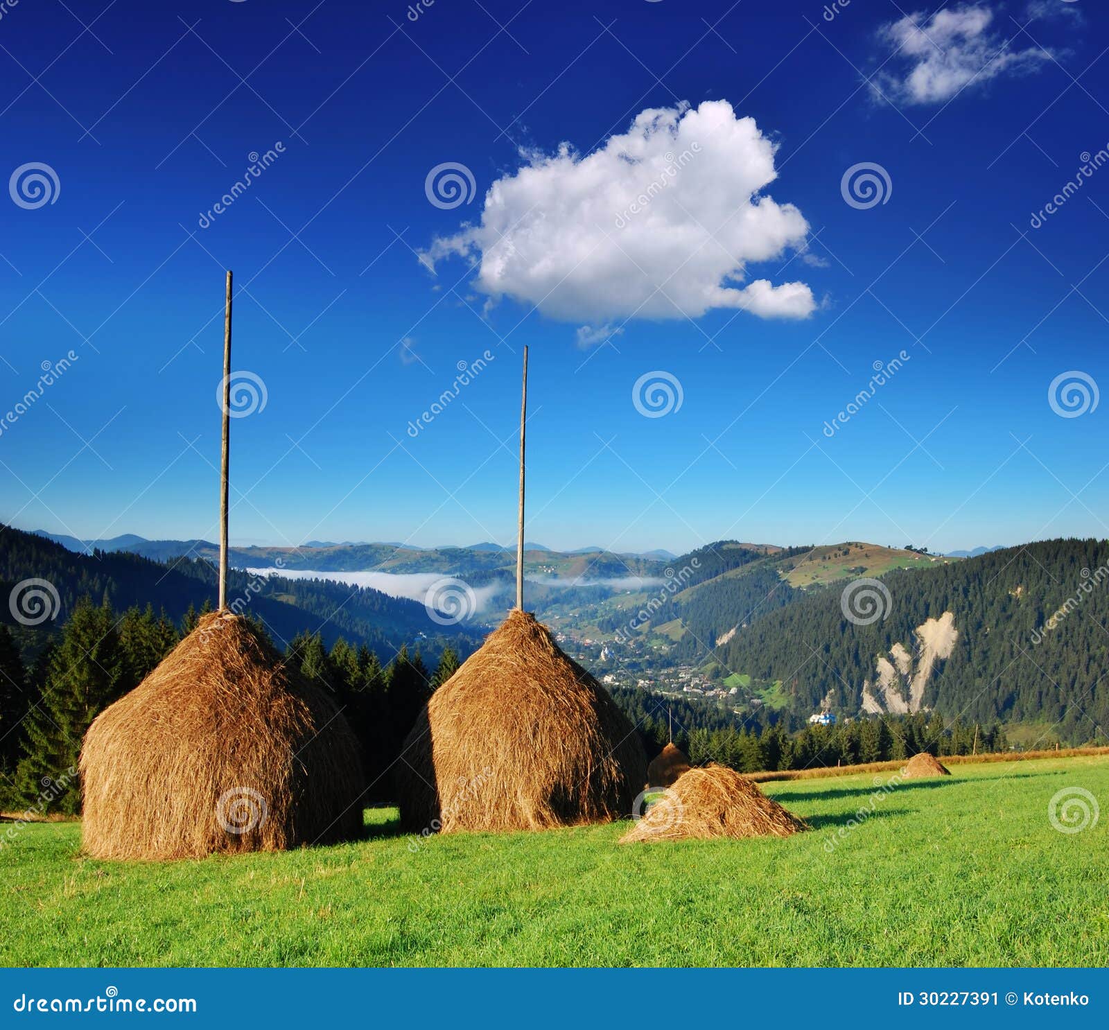 Haystacks in the mountains stock image. Image of farmyard 30227391