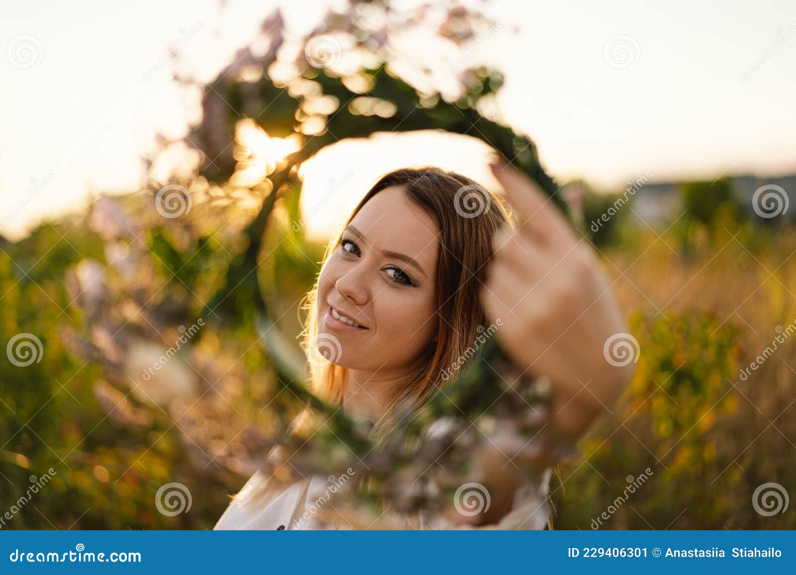 Portrait of a young beautiful woman with flowers. by 