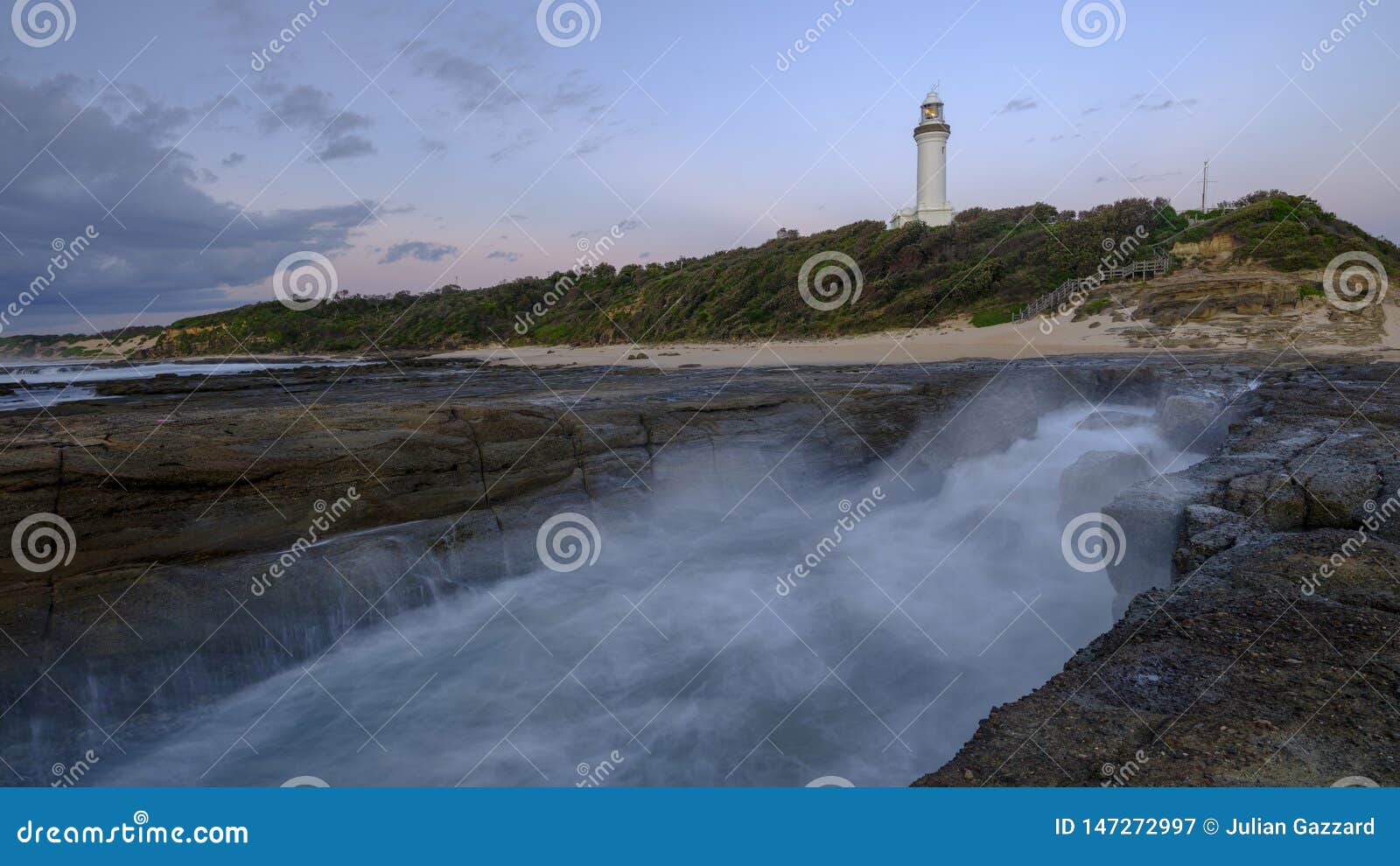 summer morning golden light on norah head light house, central coast, nsw, australia