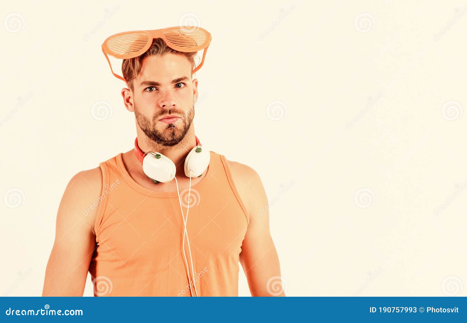 summer music chart. handsome man with headphones and sunglasses. guy unshaven face listening summer music. party concept