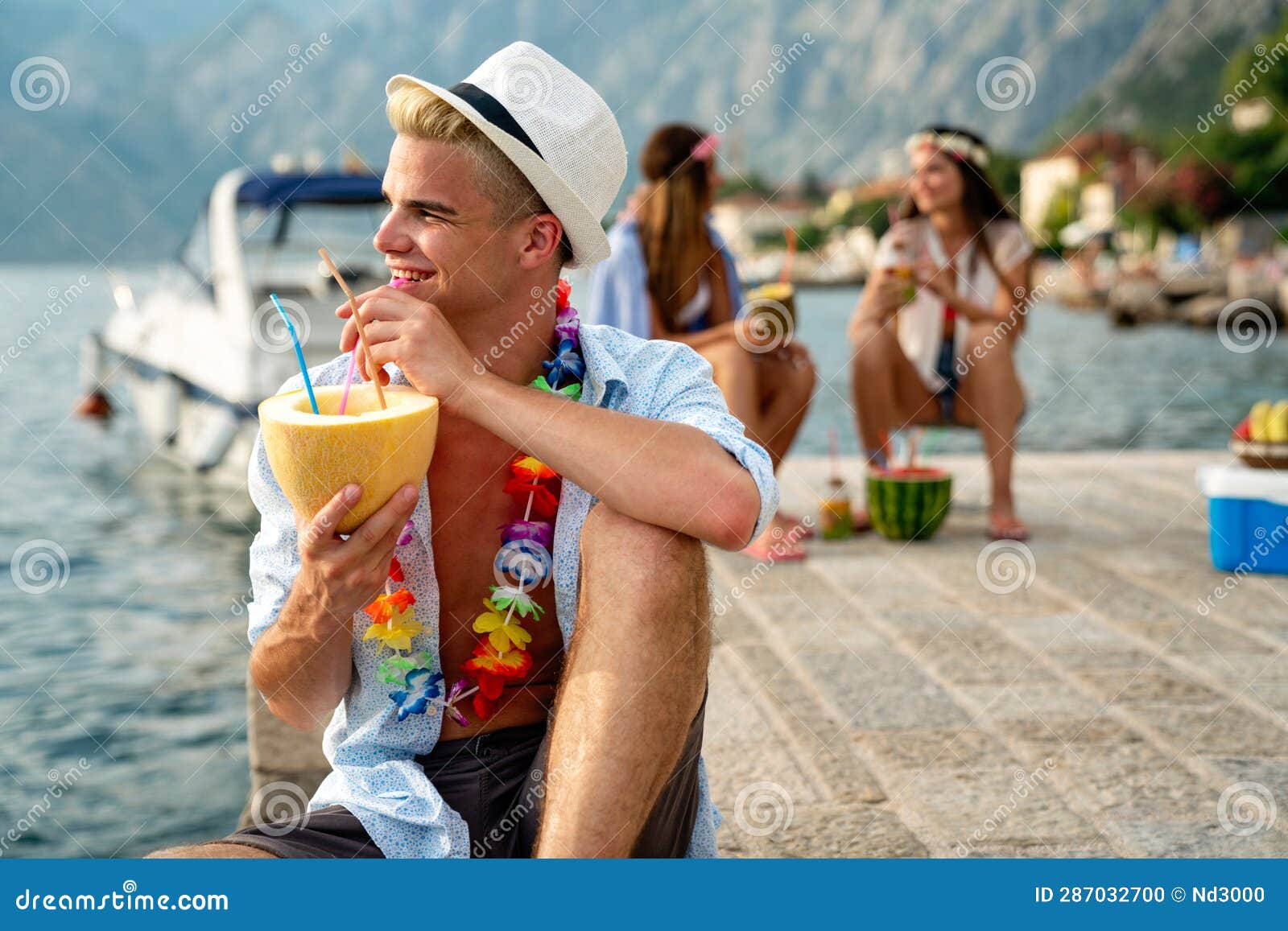 Enjoying life. Back side of young man looking at the sea, vacations  lifestyle, mindfulness, summer fun concept Stock Photo