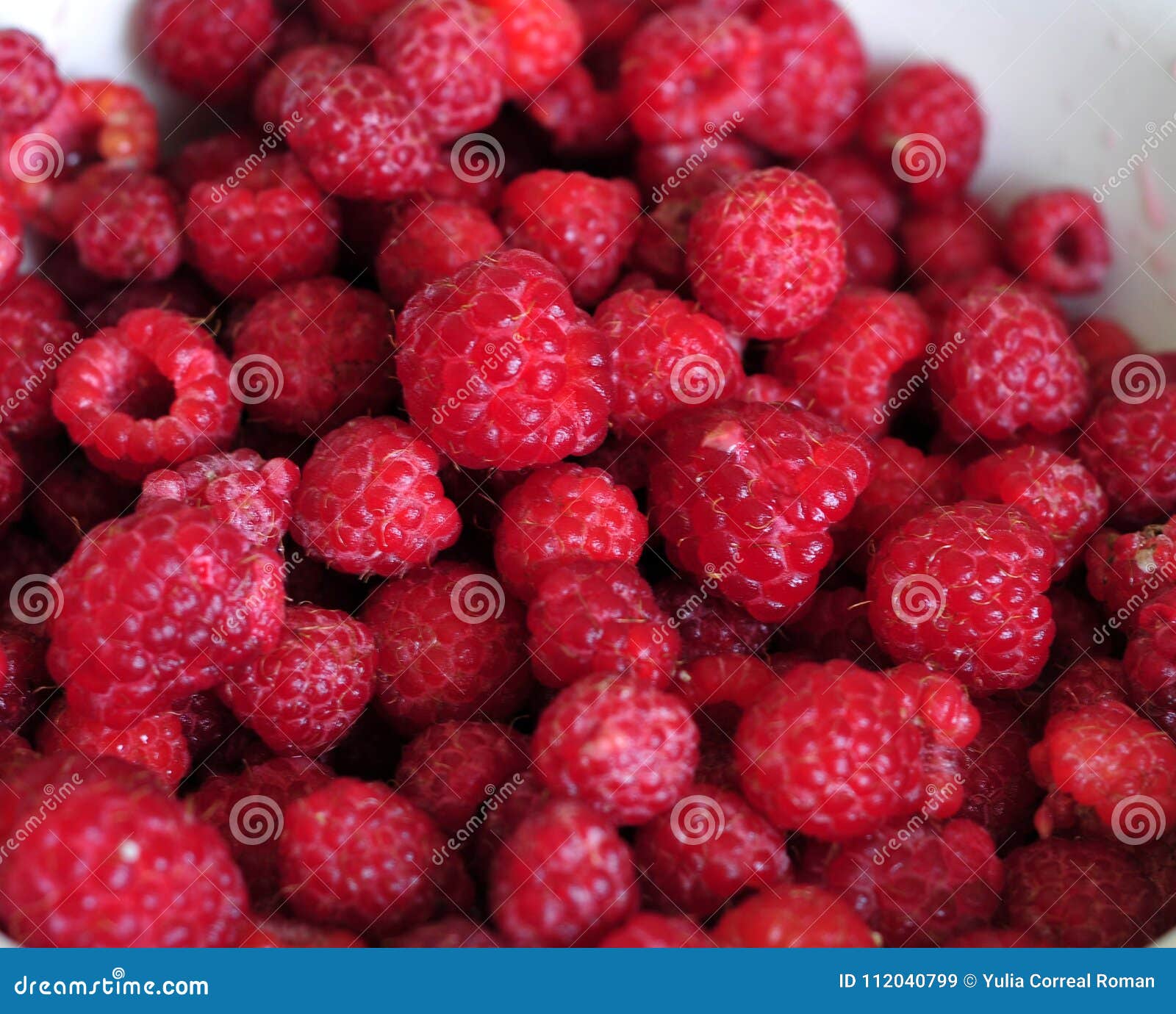 red raspberries on the white plate