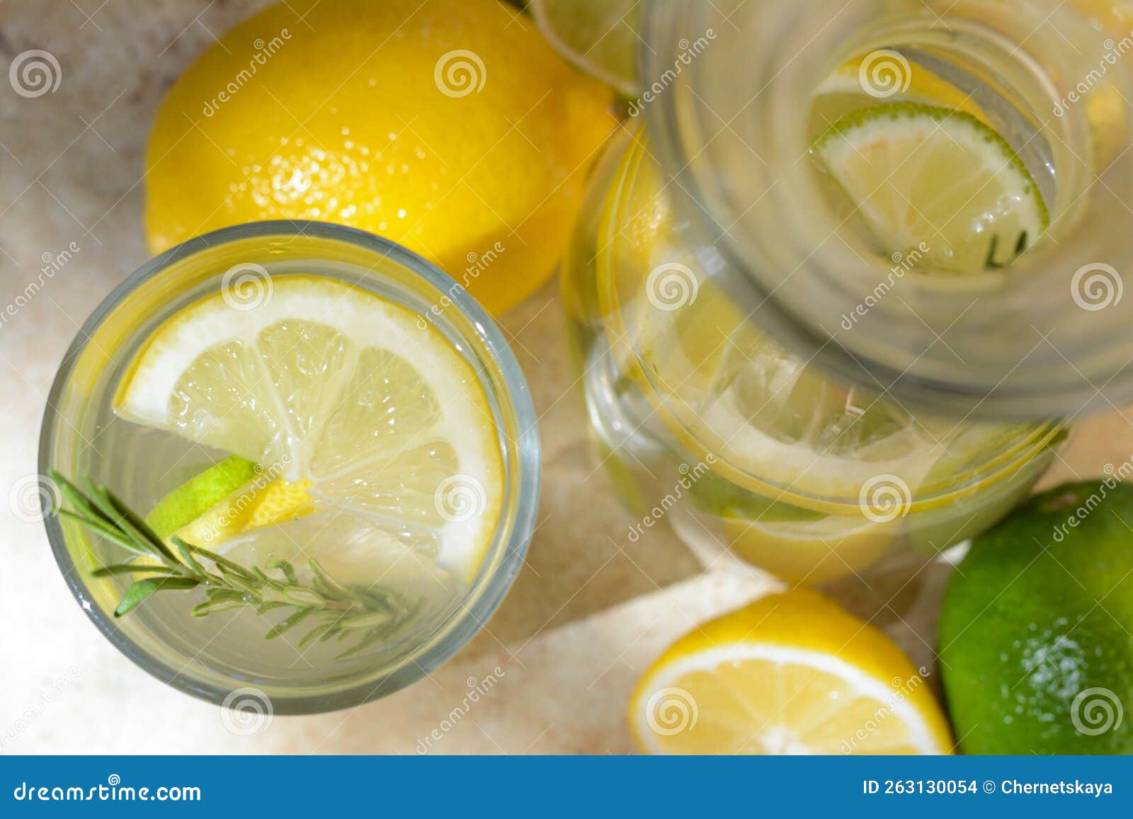 Summer Refreshing Lemonade Drink with Ingredients on Light Table, Top
