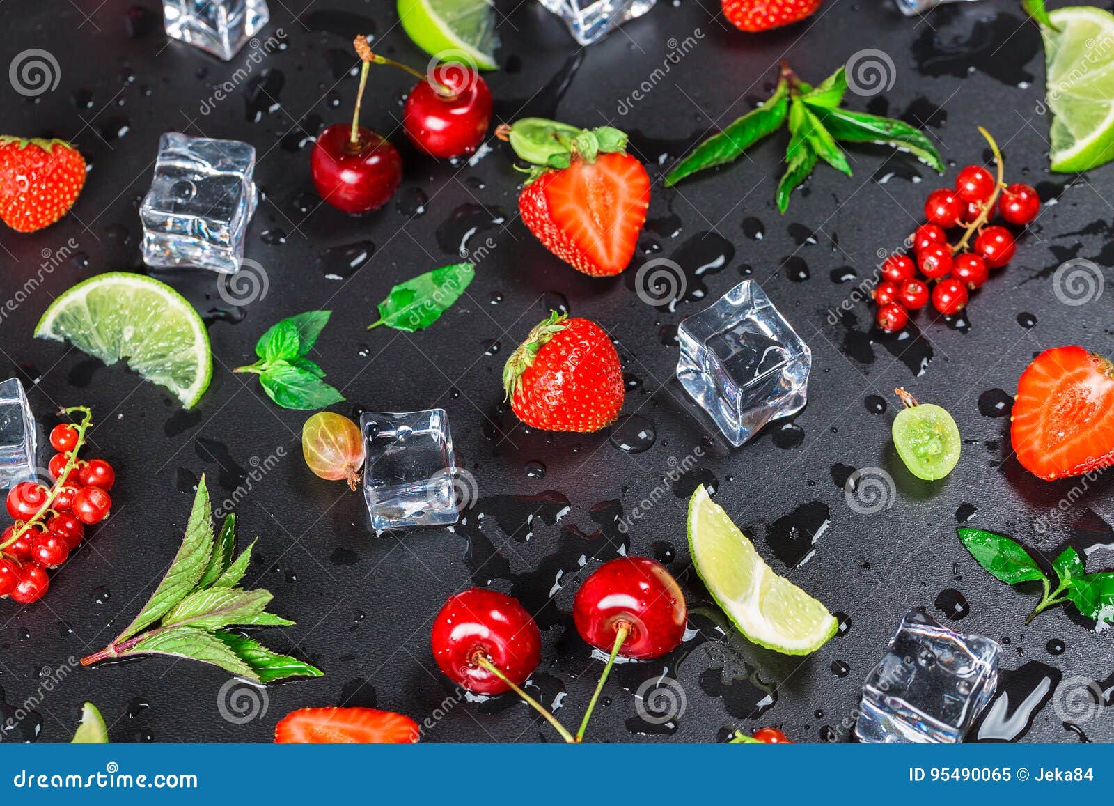 summer`s freshest fruit and berries currants, gooseberries, cherries, limes, strawberries and fresh mint leaves