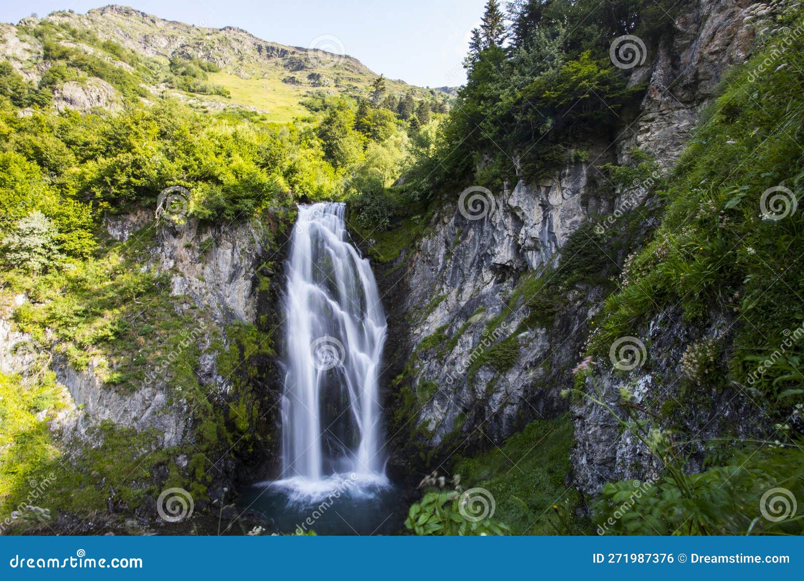 summer in sauth deth pish waterfall, val d aran, spain