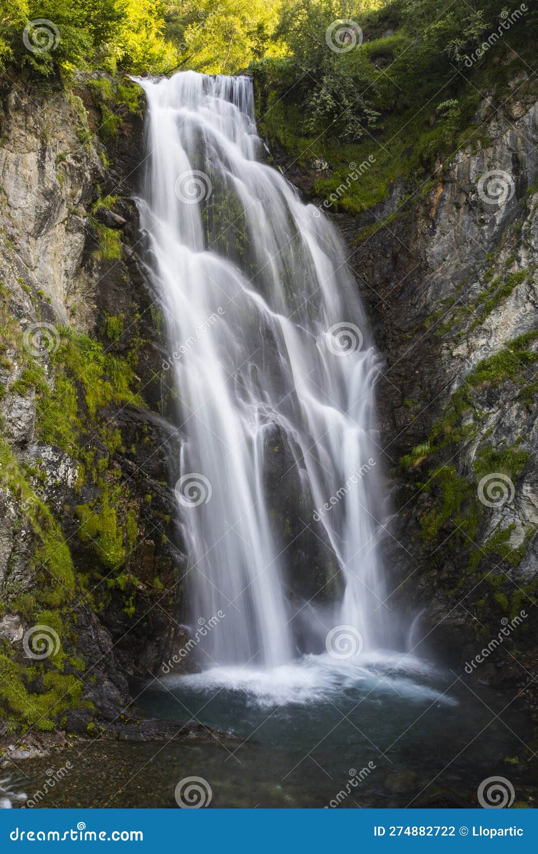 summer in sauth deth pish waterfall, val d aran, spain