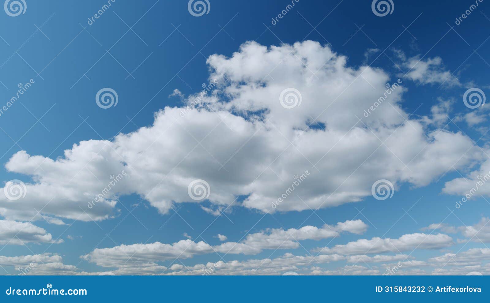summer sky. stratus and stratocumulus clouds on bright blue sky. wispy stratus clouds pass over blue sky in nature