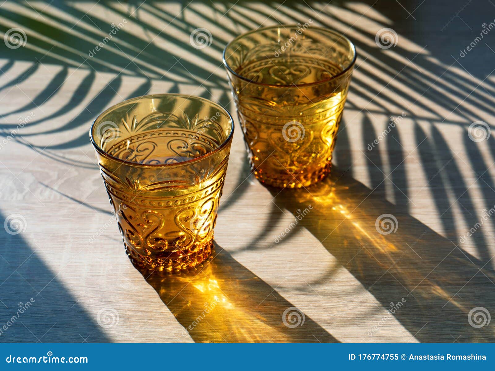 Summer Solar Photography Two Yellow Glass Glasses Illuminated By Bright Sunlight Stock Image