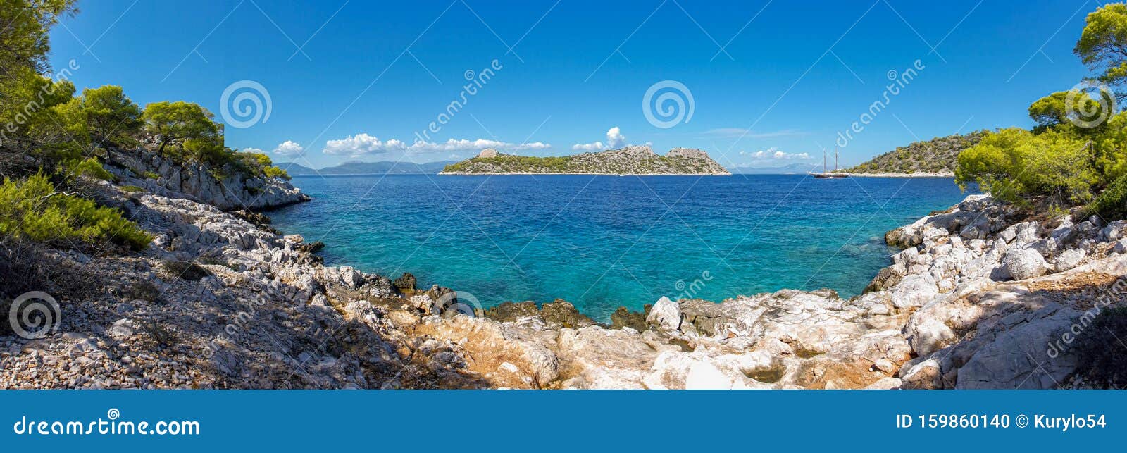 Beautiful sunny coast view to greek beach mediterranean blue sea