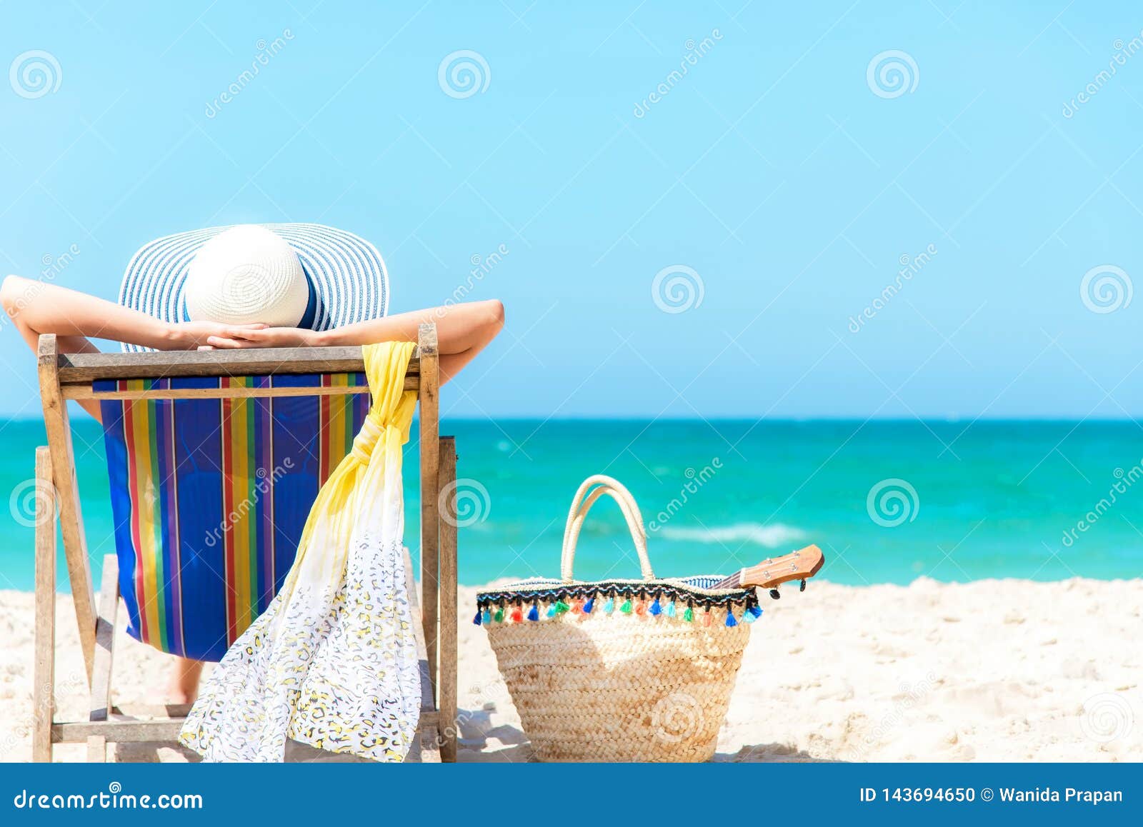 summer vacation. asian lifestyle healthy woman relaxing and happy on beach chair with cocktail coconut juice in holiday summer.  c