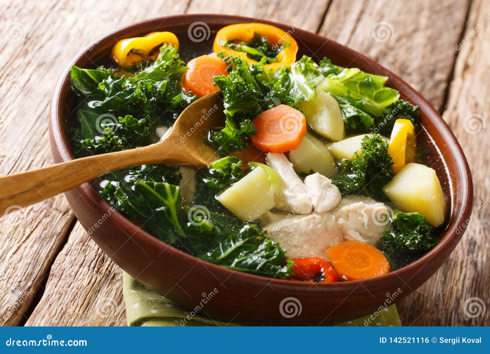 Summer Vegetable Soup with Kale and Chicken Closeup in a Bowl
