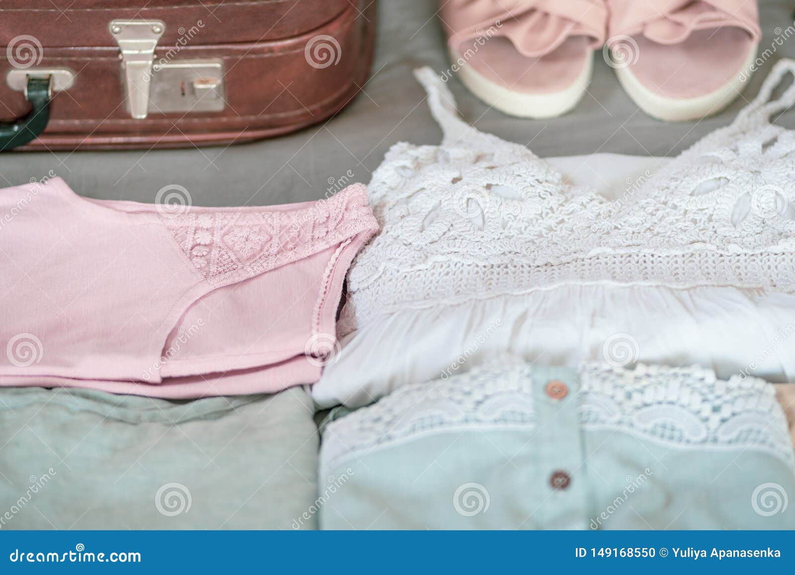 Summer Women`s Clothing Neatly Folded To Be Packed in a Suitcase. Stock ...