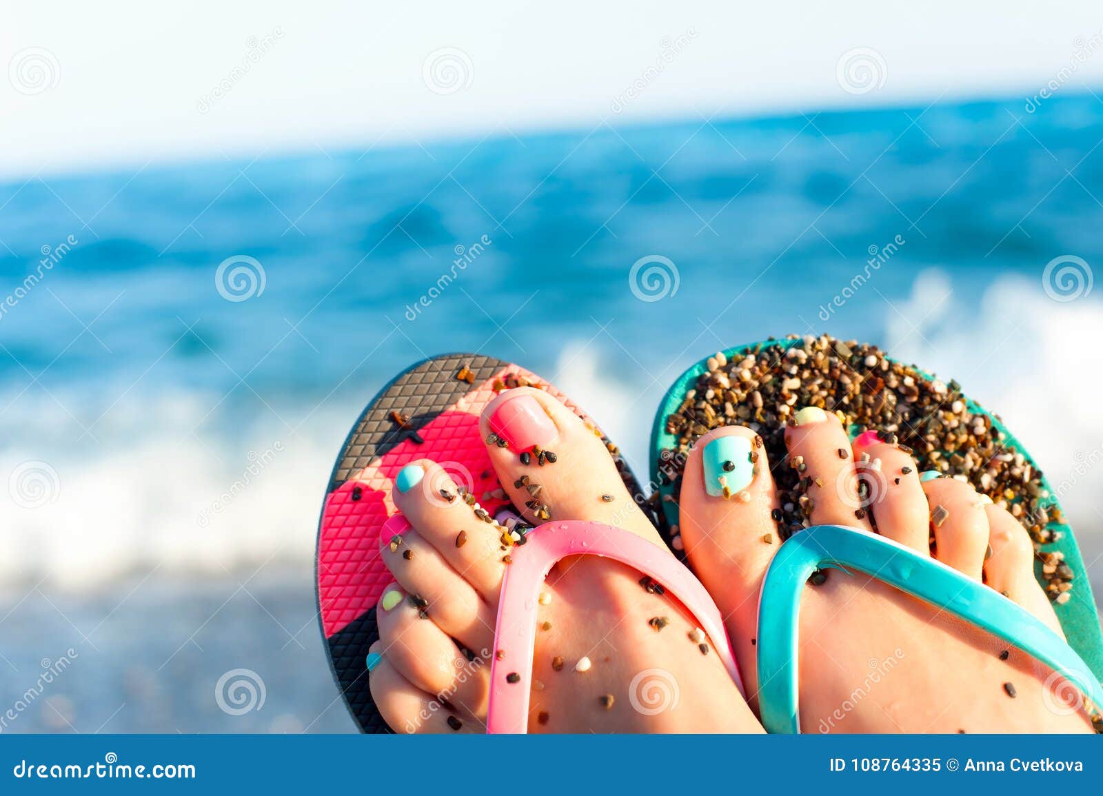 Summertime Enjoyment! Lady`s Feet on the Beach. Ocean Waves Back Stock ...