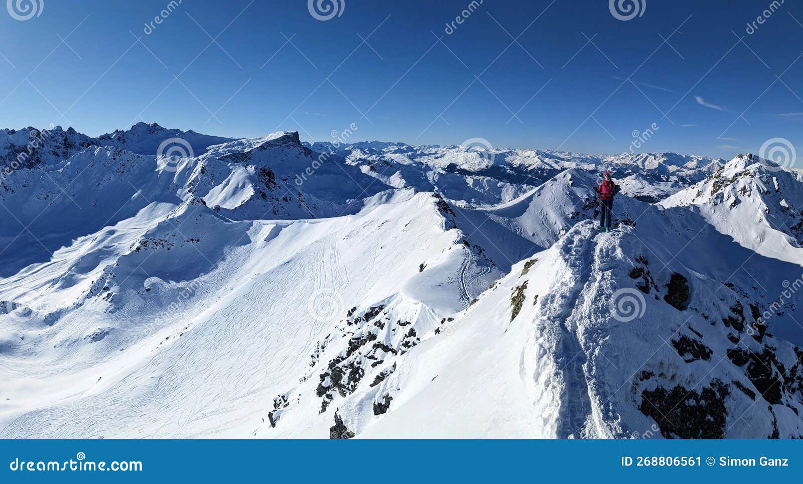 summit ridge to riedchopf ronggspitz in switzerland austria. fantastic winter mountain weather. ski mountaineering