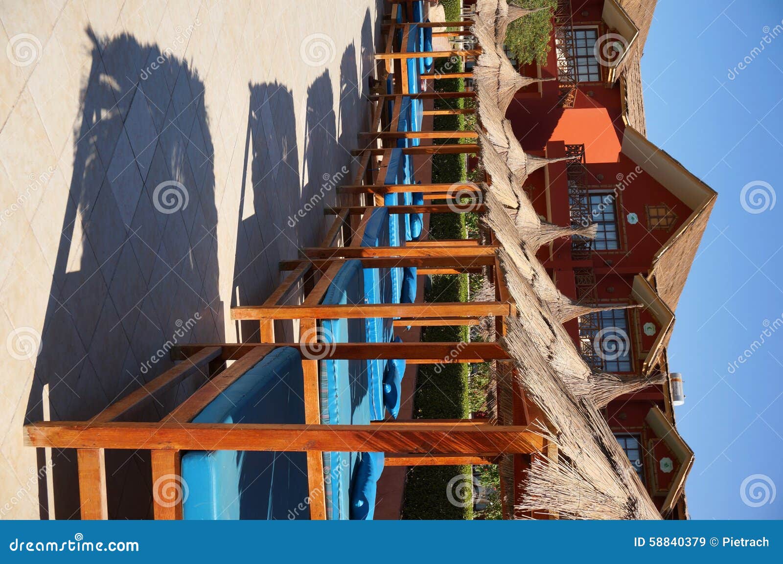 Sun Beds in Holiday Resort editorial stock image. Image of umbrella
