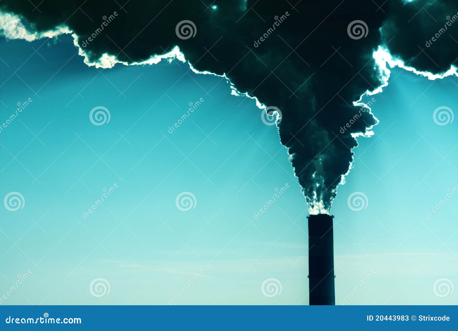 Factory With Smoke And Steam Coming Out Of The Chimneys Captured Behind