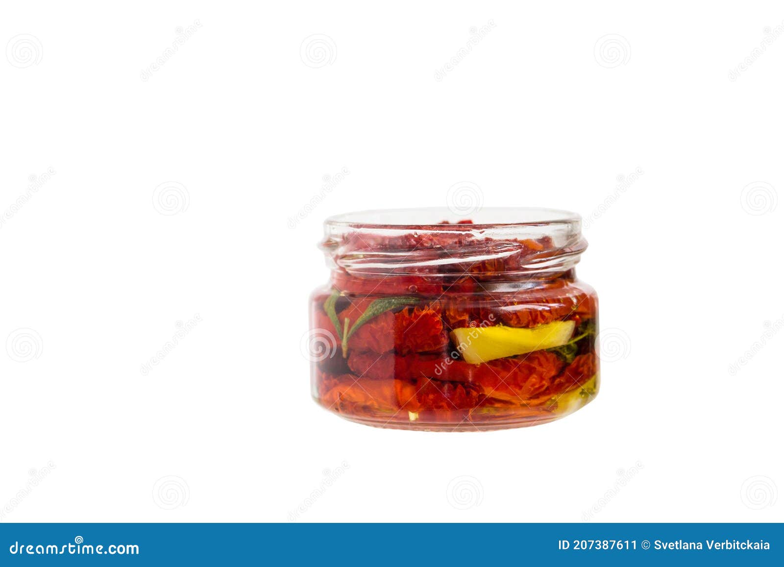 Sundried Tomatoes in a Glass Jar Isolated on a White Background Stock