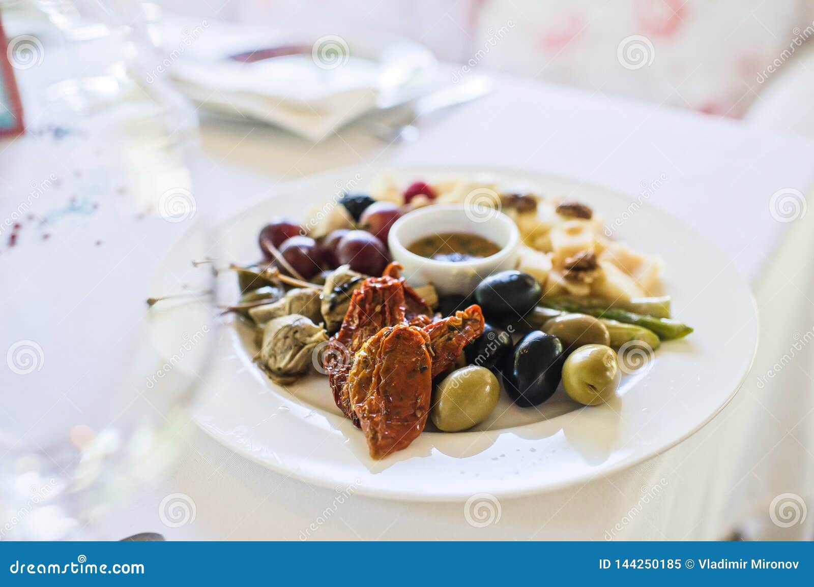 Sun Dried Tomatoes and Green and Black Olives. Stock Image Image of