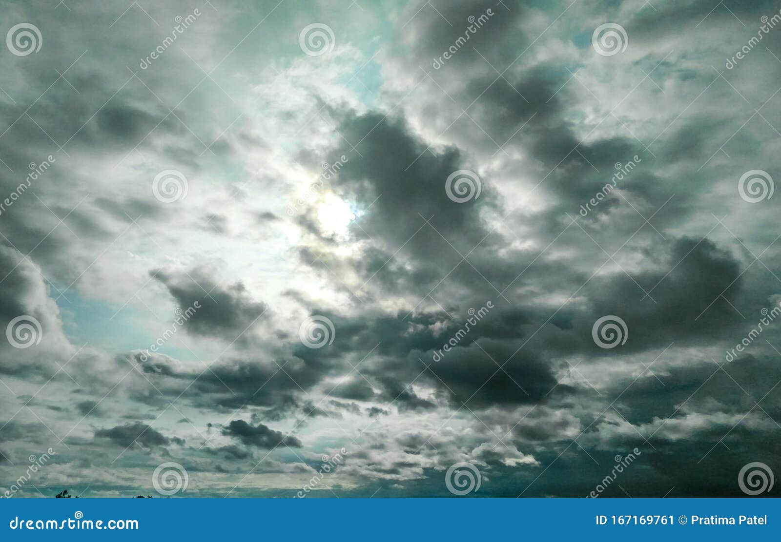 Sun Hiding Behind the Dark Black Clouds Over the Blue Sky, Dramatic Sky,  Atmospheric Moods and Bad Weather Background Stock Image - Image of  dramatic, moods: 167169761