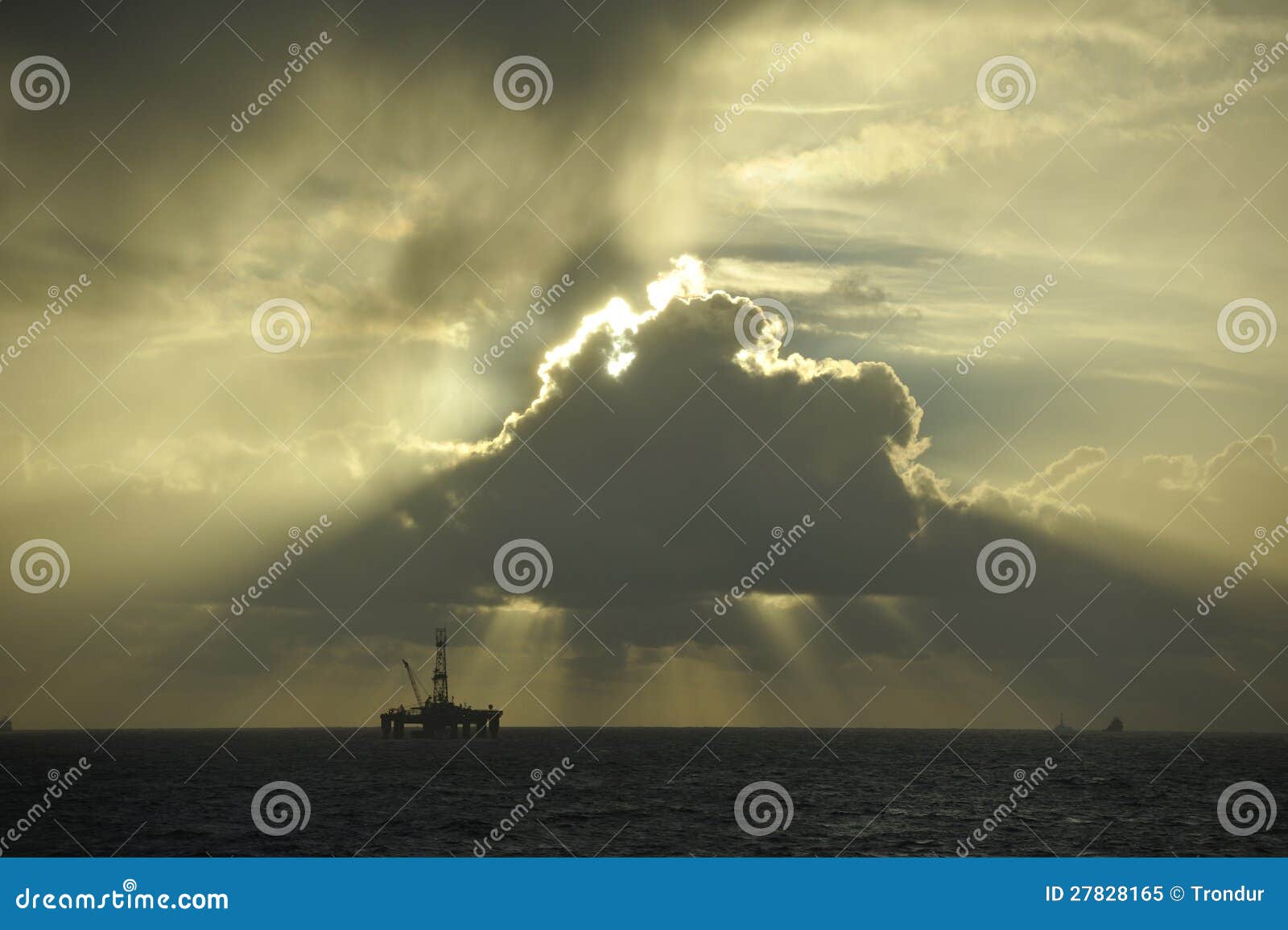 sun light beams over oil platform